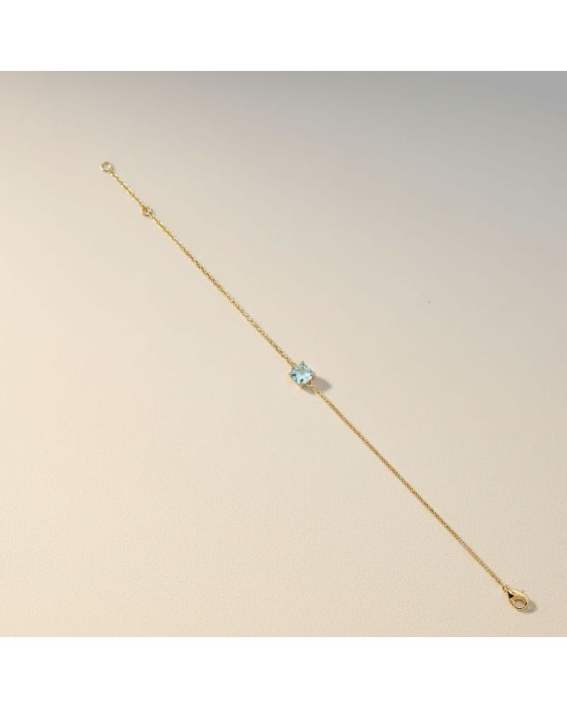 bracelet fin chaine plaqué or 18 carats avec pierre facette teintée couleur aigue marine