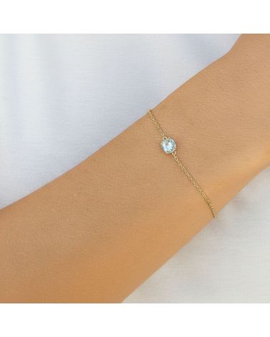 bracelet fin chaine plaqué or 18 carats avec pierre facette teintée couleur aigue marine