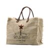 Grand sac de plage cabas beige Sel de Mer en toile de coton avec anses en cuir et étoile brodée sur fond blanc