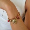bracelet breloque soleil et pierres sur fil lurex rouge mile mila