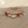bracelet sur fil rouge et lurex breloques soleil mile mila