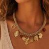 collier aigle & charms dorés collier lien tressé style cow girl western chic avec breloque aigle ,feuille, et tête d'indien bijou mile mila acier doré
